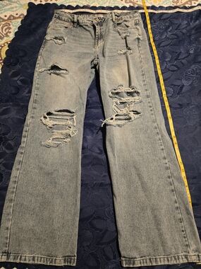 Refuge Denim Low Ride Skater Jeans With Wide Legged Purposely Distressed Look